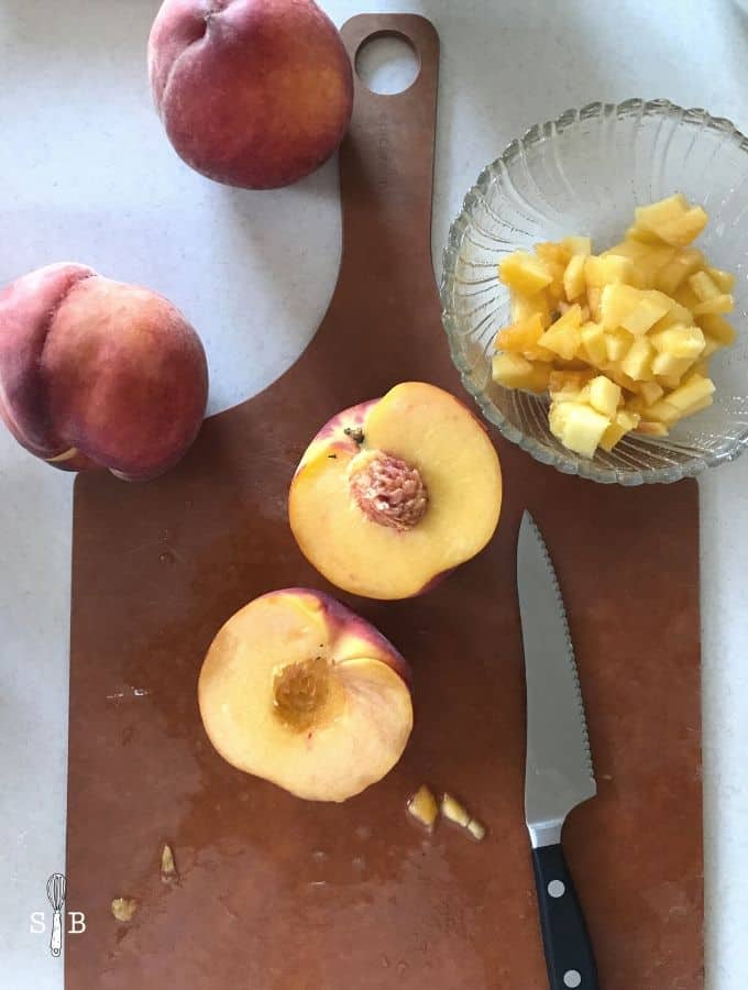 fresh peaches on cutting board