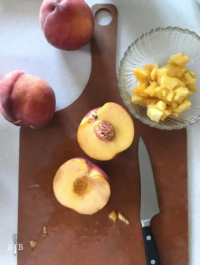 fresh peaches on cutting board