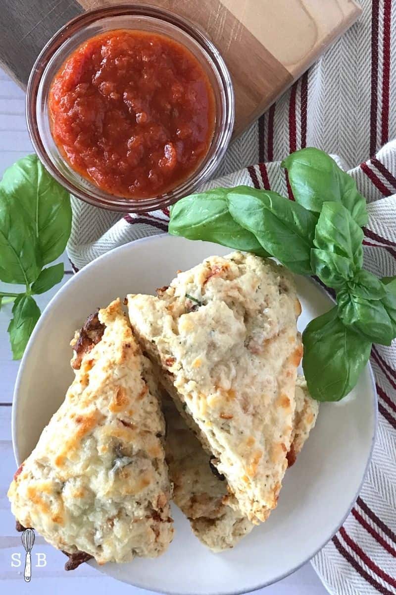 Pizza scones on plate with marinara sauce