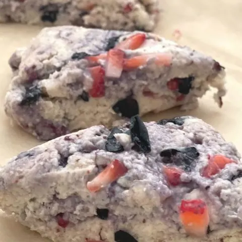 Red white and blue scones with blueberries and strawberries