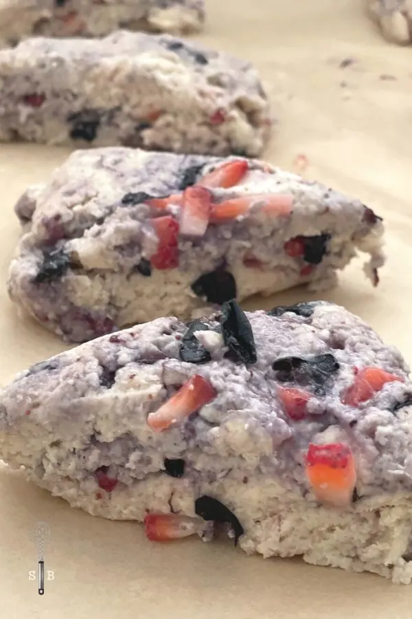 Red white and blue scones with blueberries and strawberries