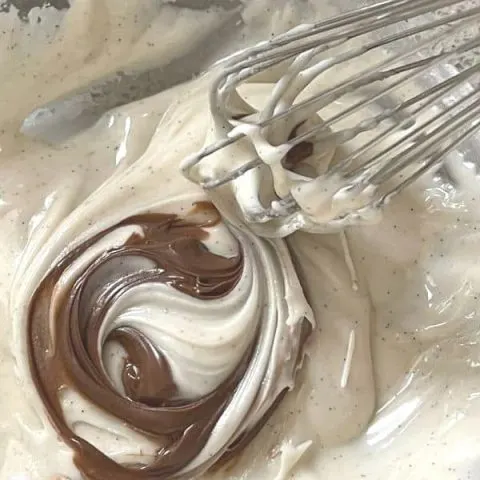 Whisking nutella hazelnut spread into a glaze for scones