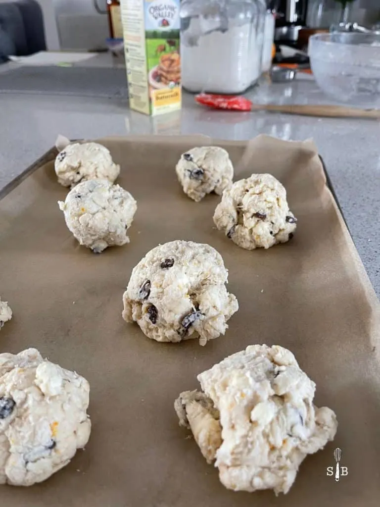 Large scones on baking sheet