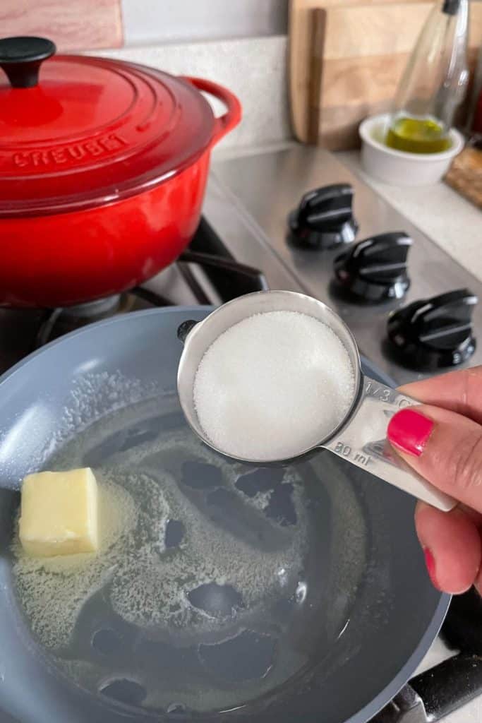 adding sugar in pan