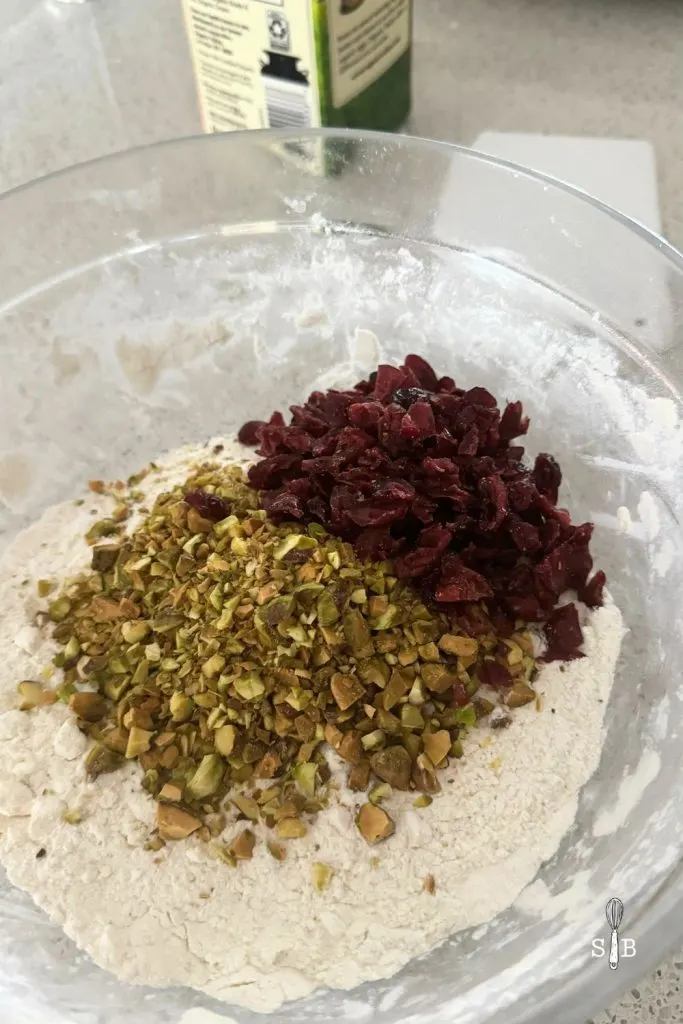 dried cranberries and pistachios in scone flour mixture