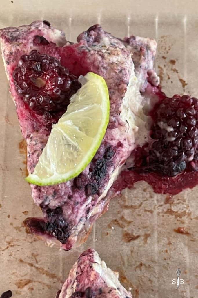 Tangy lime and blackberry scone wedge